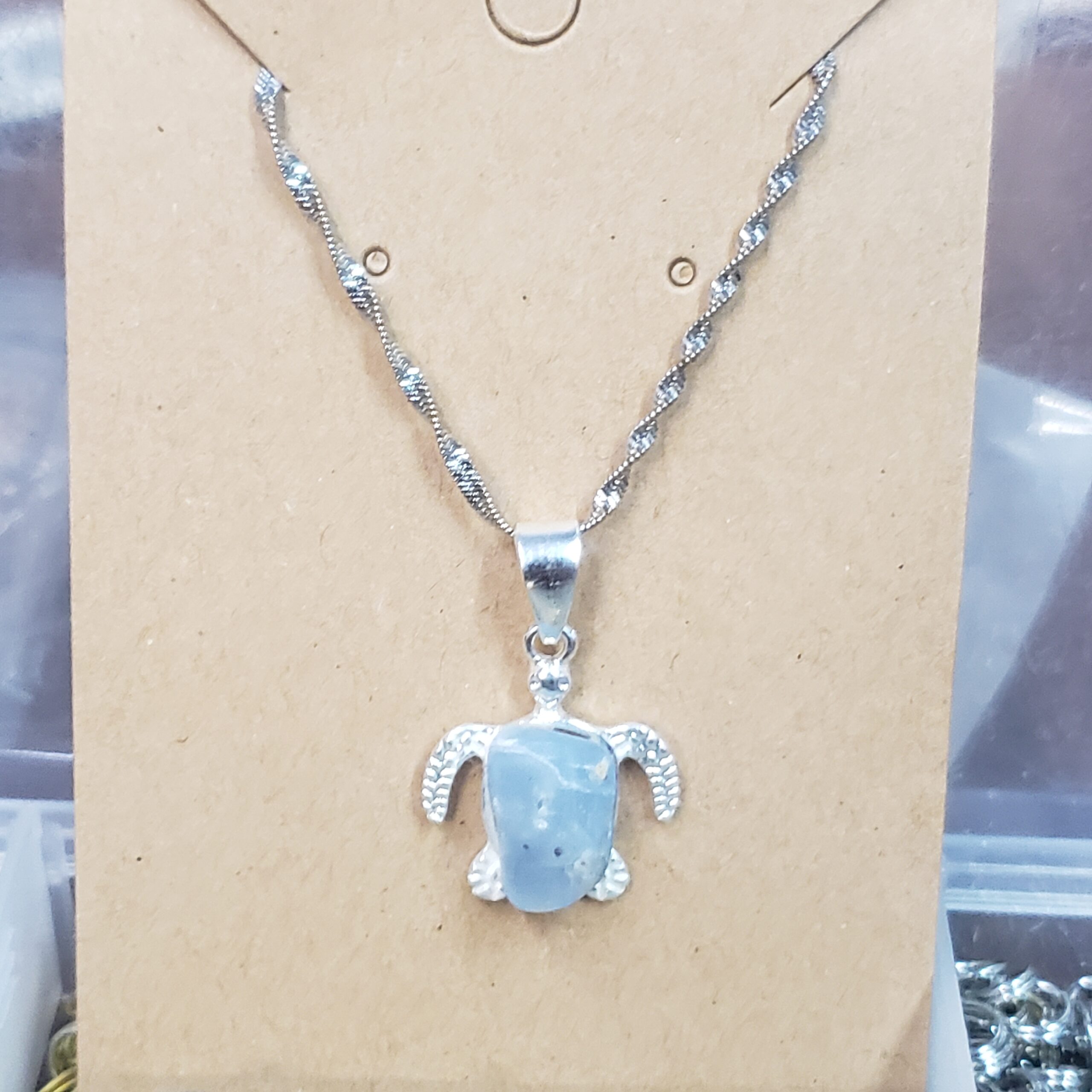 Adirondack Blue Calcite on a turtle pendant .