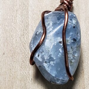Adirondack Blue Calcite  wire wrapped in copper/ on a black cord chain.
